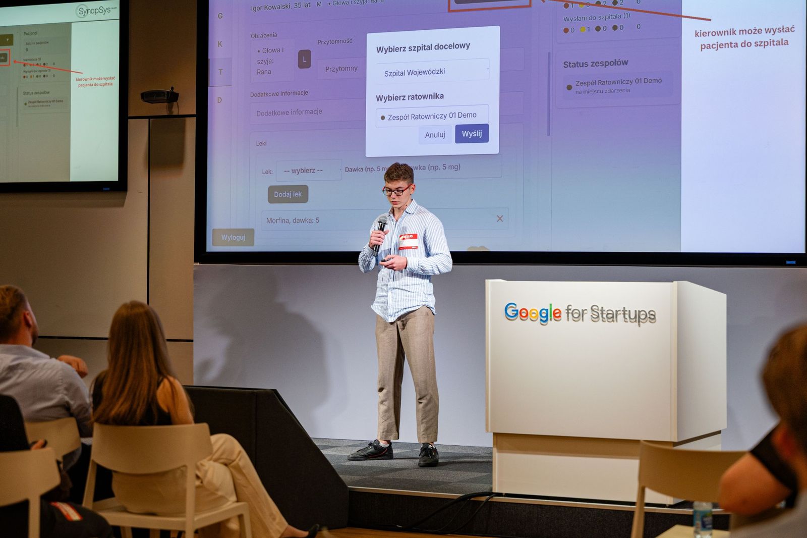 Mikita presenting on a Google for Startups stage in front of a screen showing the mass-casualty version of mTriage, with a dialog for choosing the destination hospital and the rescue team.